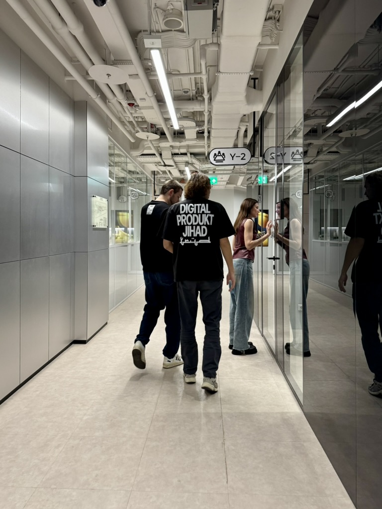 Colleagues walking through an office hallway