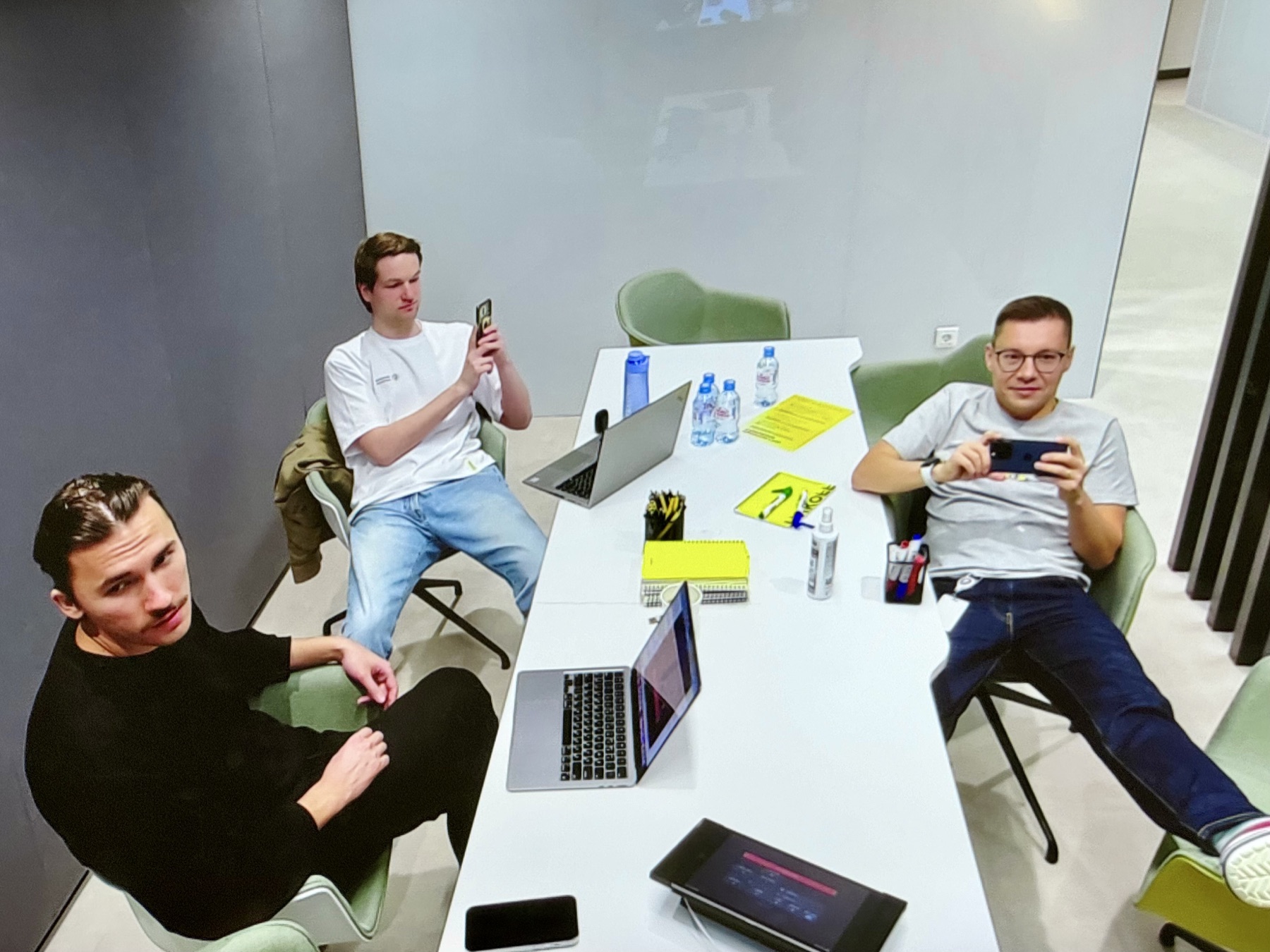 Three CPO Team members around a meeting table